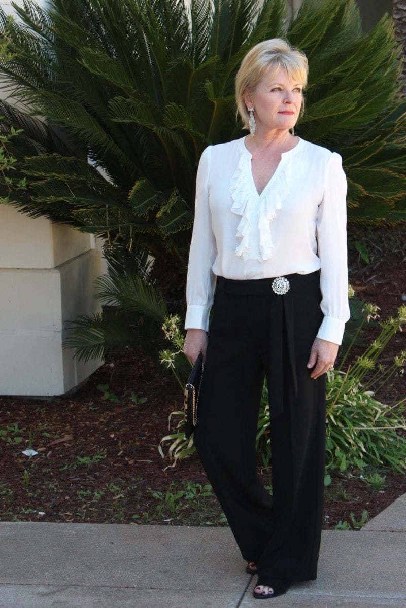 Black and white separates from Chico's with vintage pin and suede booties
