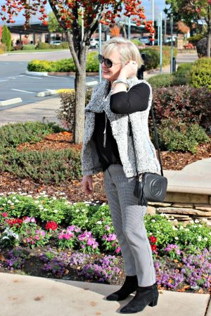 jennifer connolly of a well styled life wearing black gingham pants and gray fuzzy vest