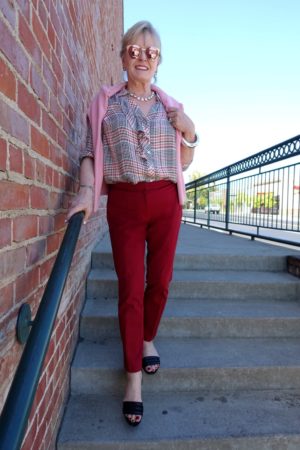 causal outfit with of red pants and pink plaidshirt on