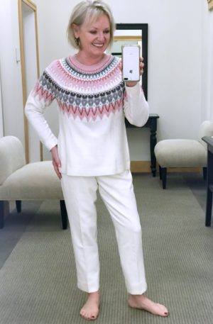 pink and gray fair isle sweater with ivory pants on Jennifer Connolly
