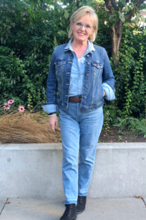 fashion blogger jennifer connolly showing how to style chambray for fall with denim jacket and boots