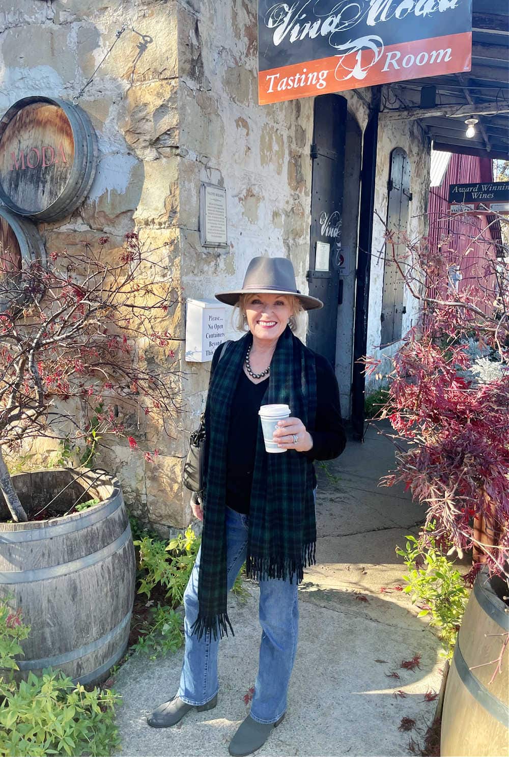 woman in gray hat holding coffee cup visiting murphy's CA
