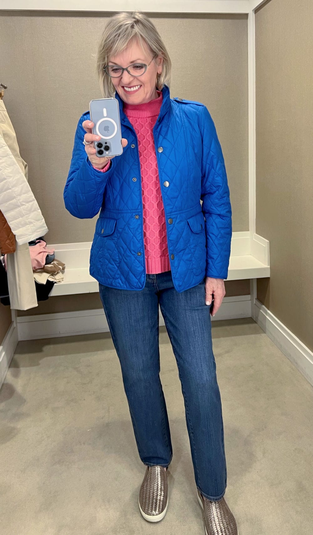 woman wearing blue jacket and jeans in talbots dressing room