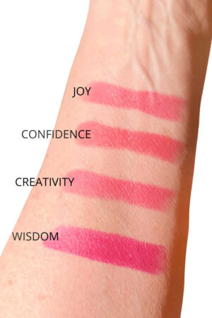 bare mineral pink lipsticks on arm