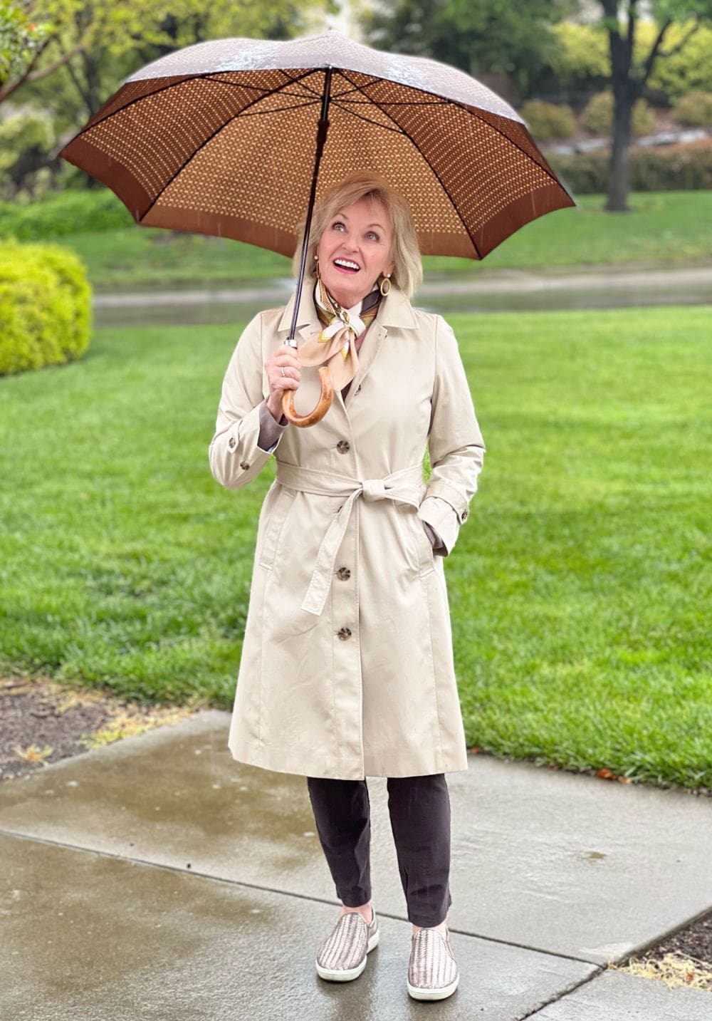 woman in rain wearing loft trench