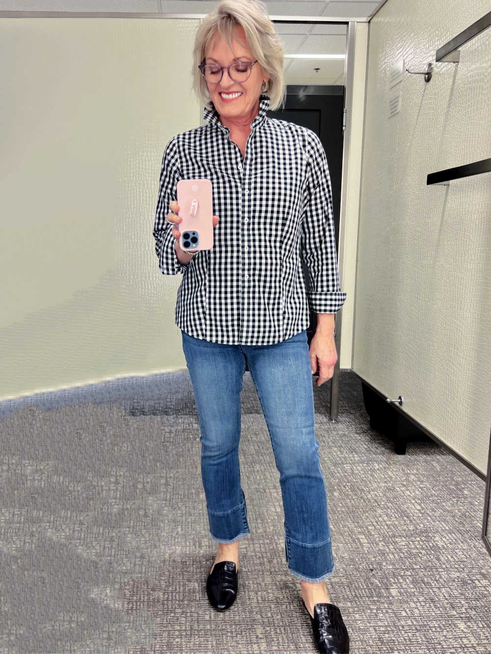 WOMAN WEARING GINGHAM SHIRT AND CROPPED JEANS