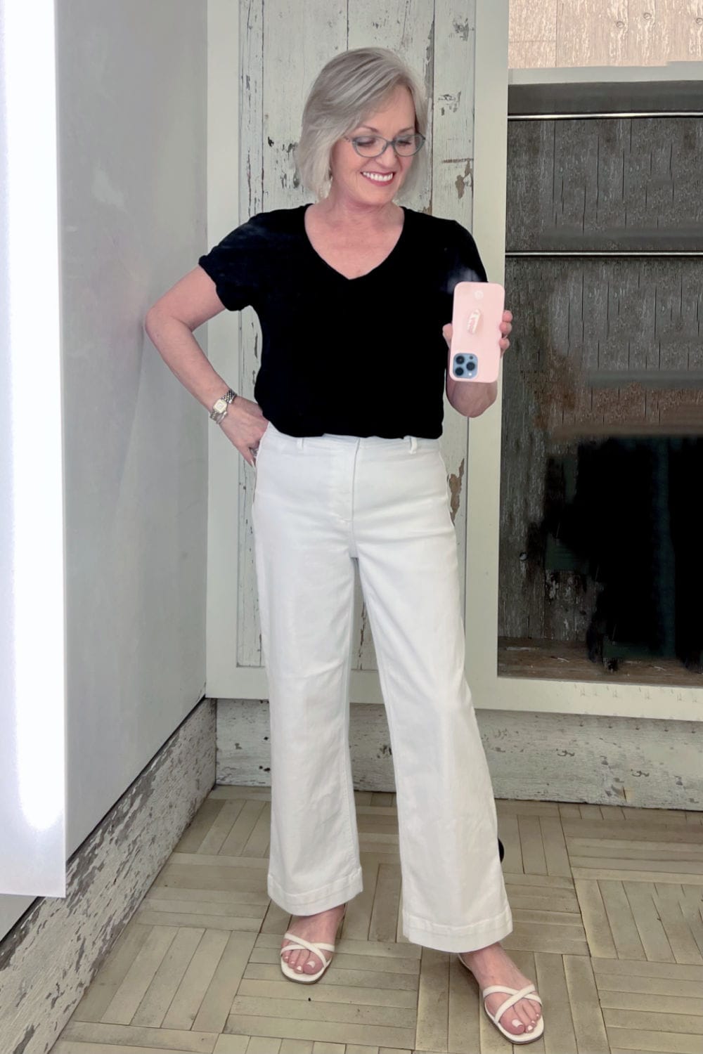 woman wearing white culottes and black tee