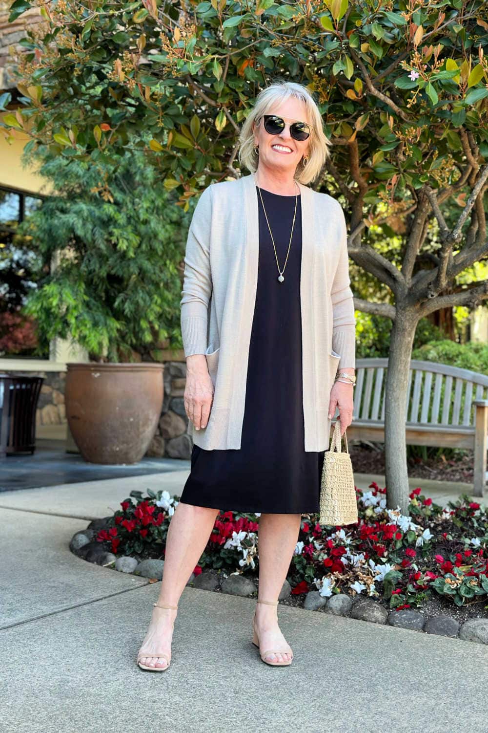 woman wearing eileen fisher t-shirt dress with long cardigan and low block heels