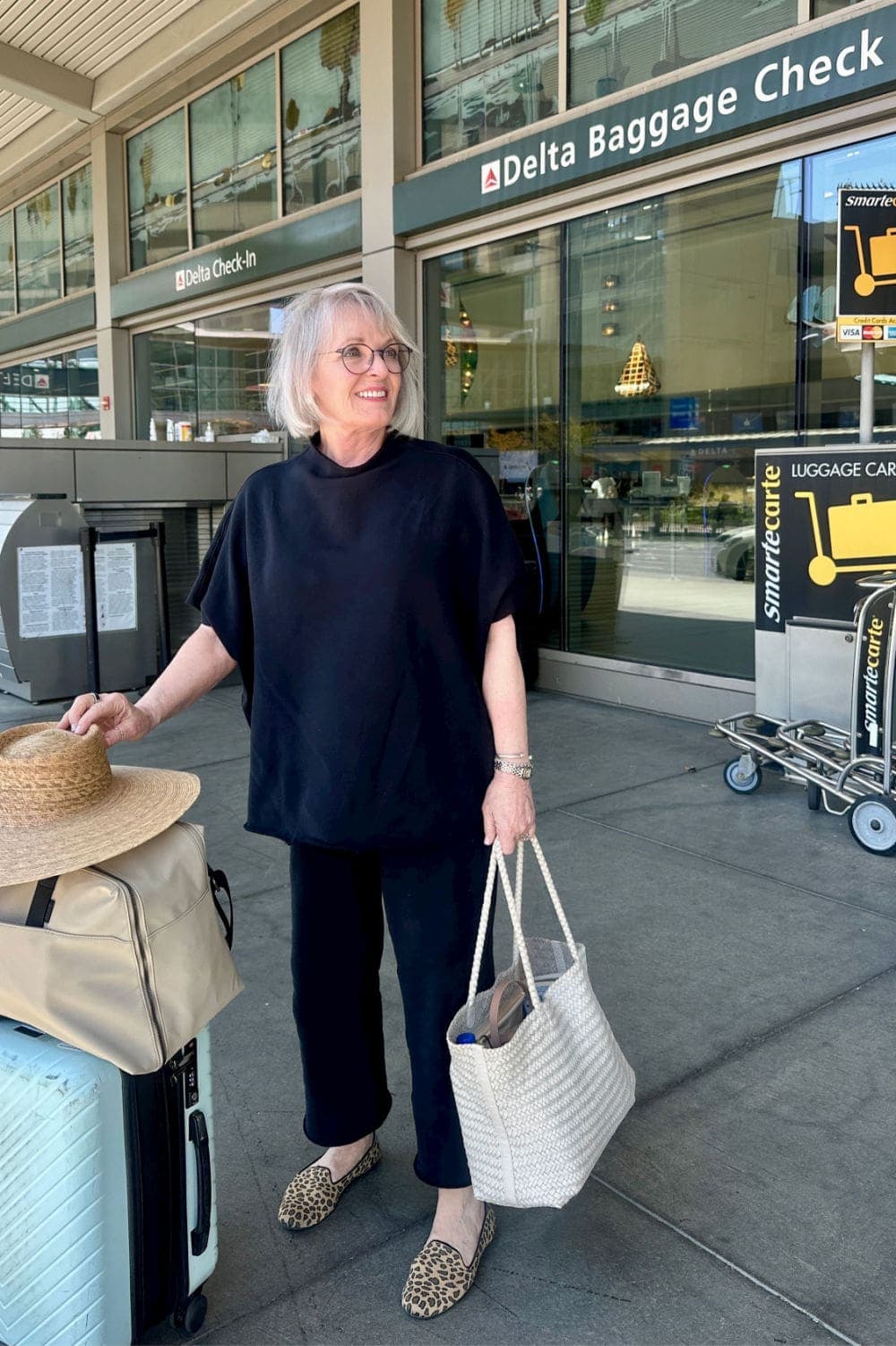 JENNIFER FROM A WELL STYLED LIFE WEARING FLEECE TRAVEL SET AT AIRPORT