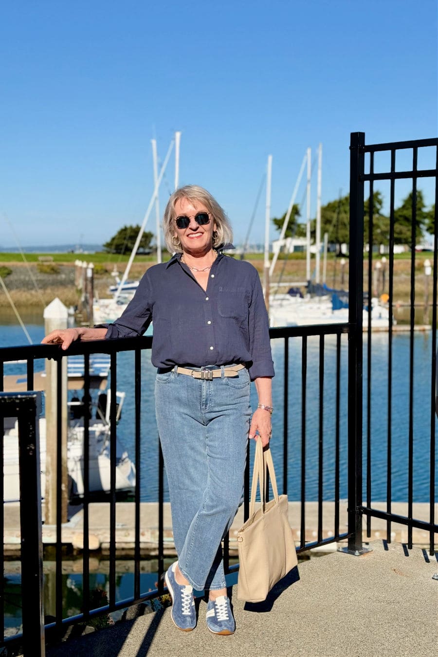 Indigo cotton gauze shirt with straight-leg jeans and blue suede sneakers for a coastal casual outfit over 60