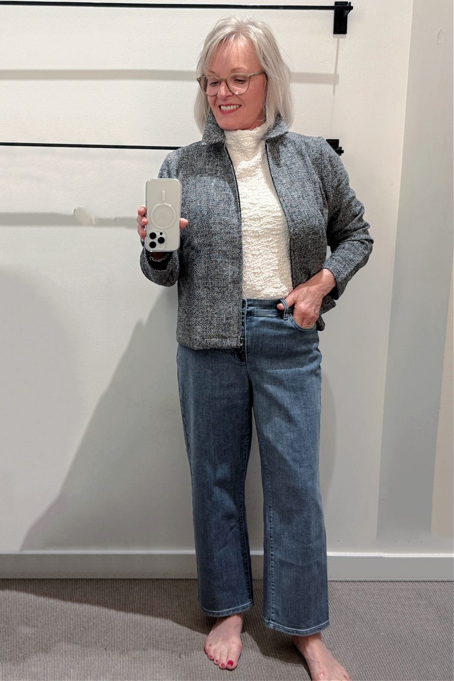 Ivory funnel neck top with bubble texture paired with classic jeans and a zip-front cotton tweed jacket.