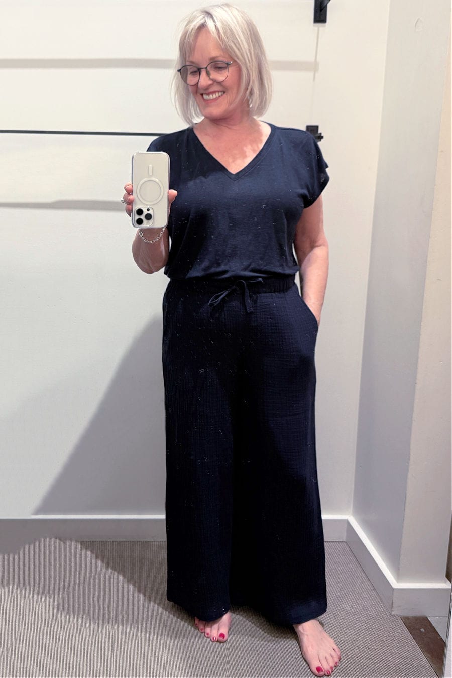 Dark ink linen jersey tee paired with wide-leg cotton gauze pants, styled for warm-weather layering.
