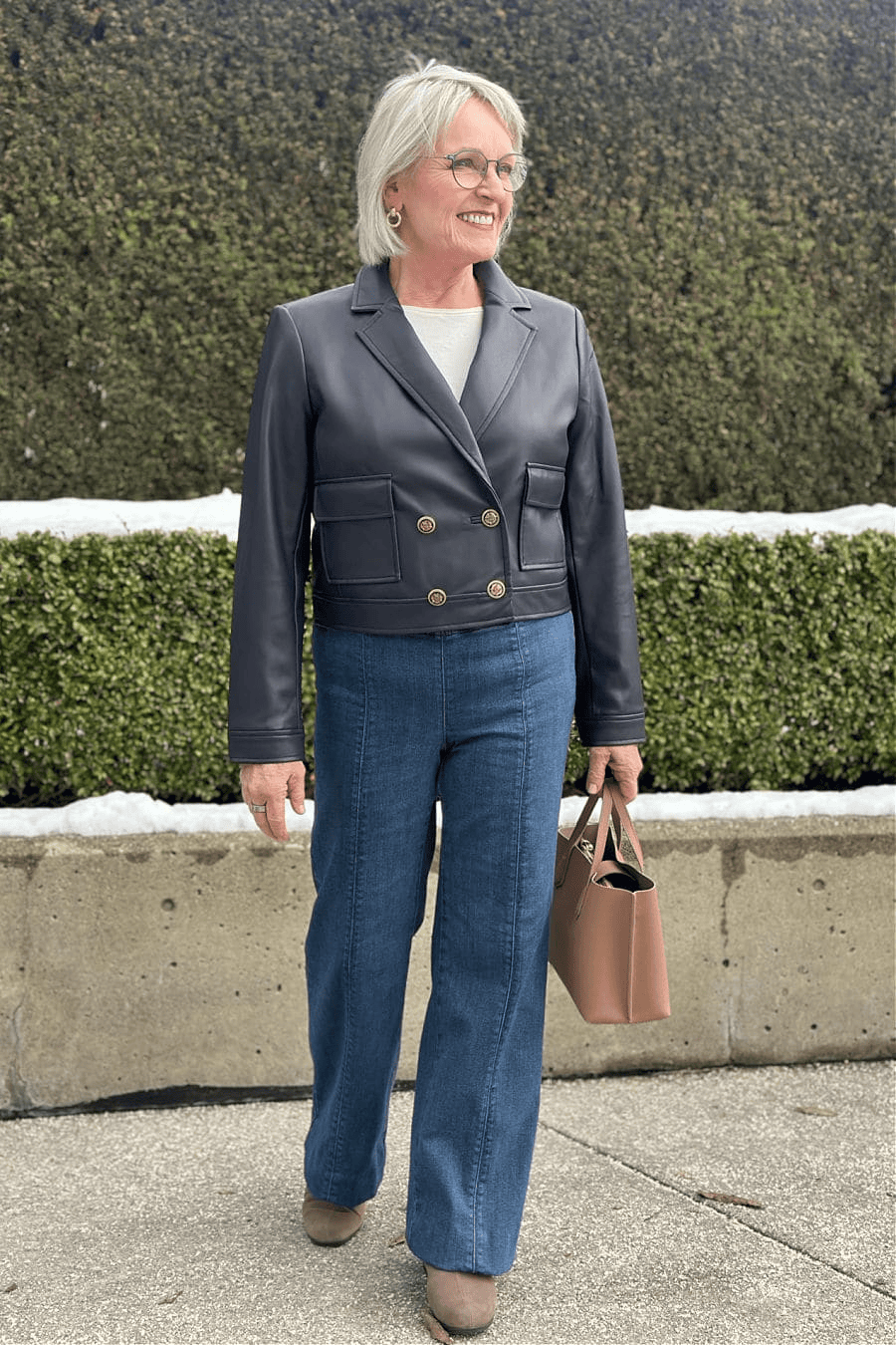 Older woman wearing talbots pull-on jeans and faux leather jacket