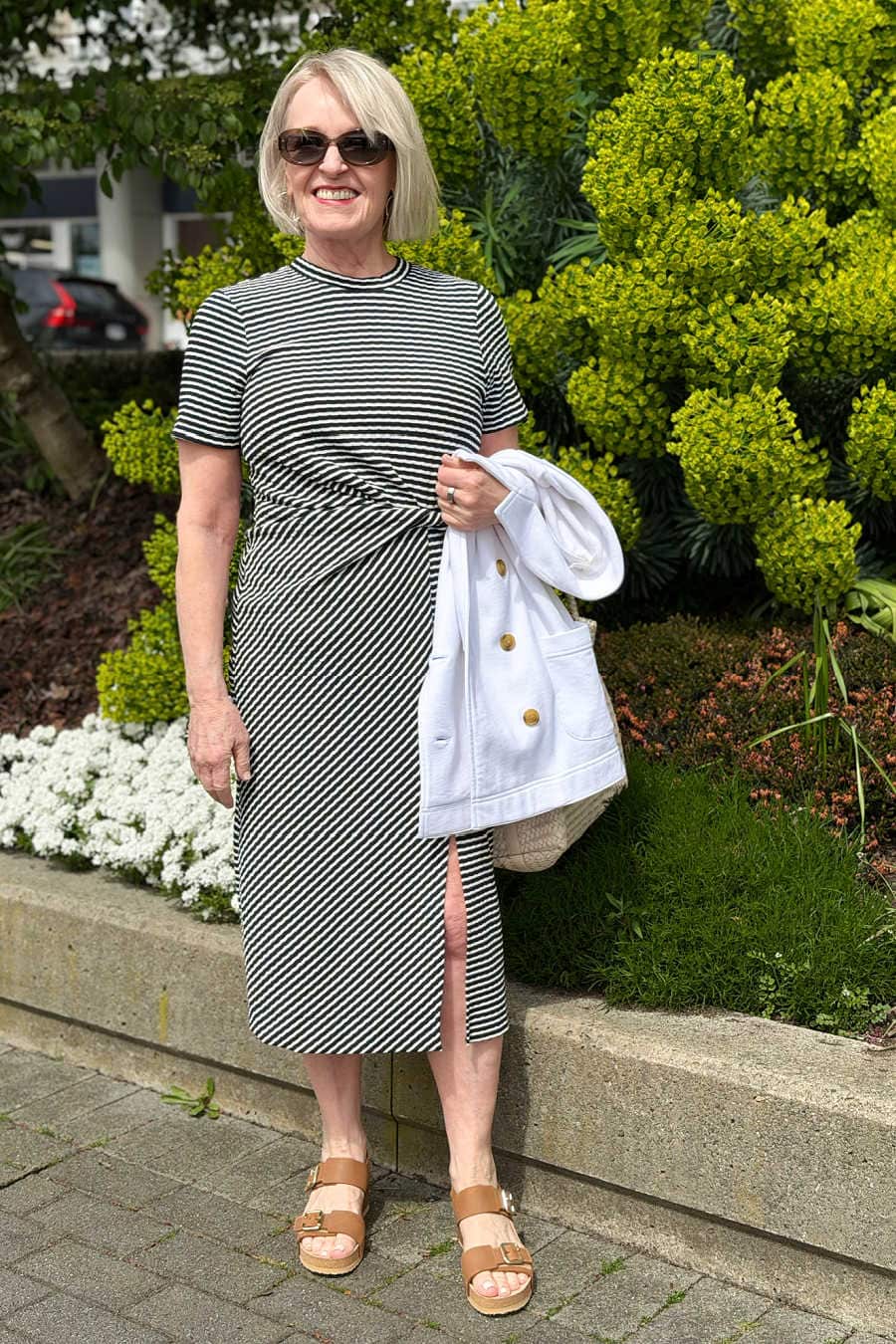 A crisp navy-and-white Nordstrom edit for spring with knit blazers, a striped dress, straight-leg jeans, comfortable sneakers, and neutral wedges.