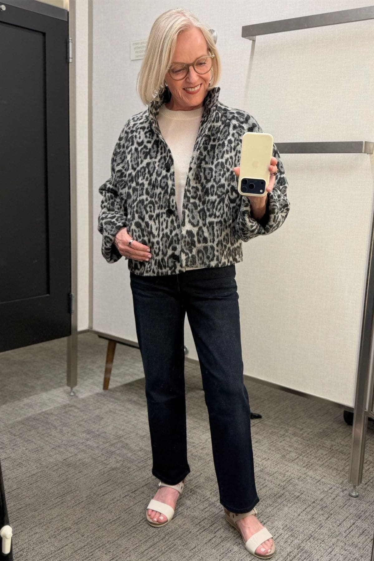Nordstrom brand Gray-and-black animal-print cropped jacket with a stand collar, bell sleeves, and deep-indigo straight-leg jeans.