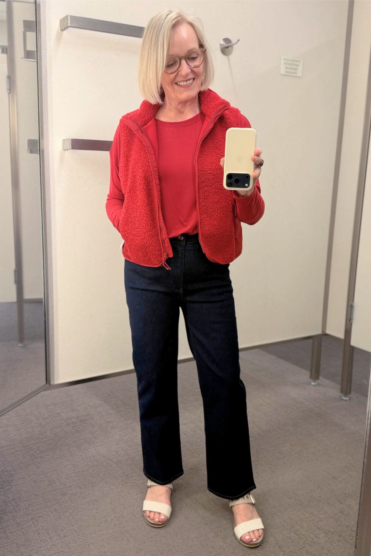 Red Zella faux shearling vest and matching long-sleeve tee with Frame petite straight-leg jeans.