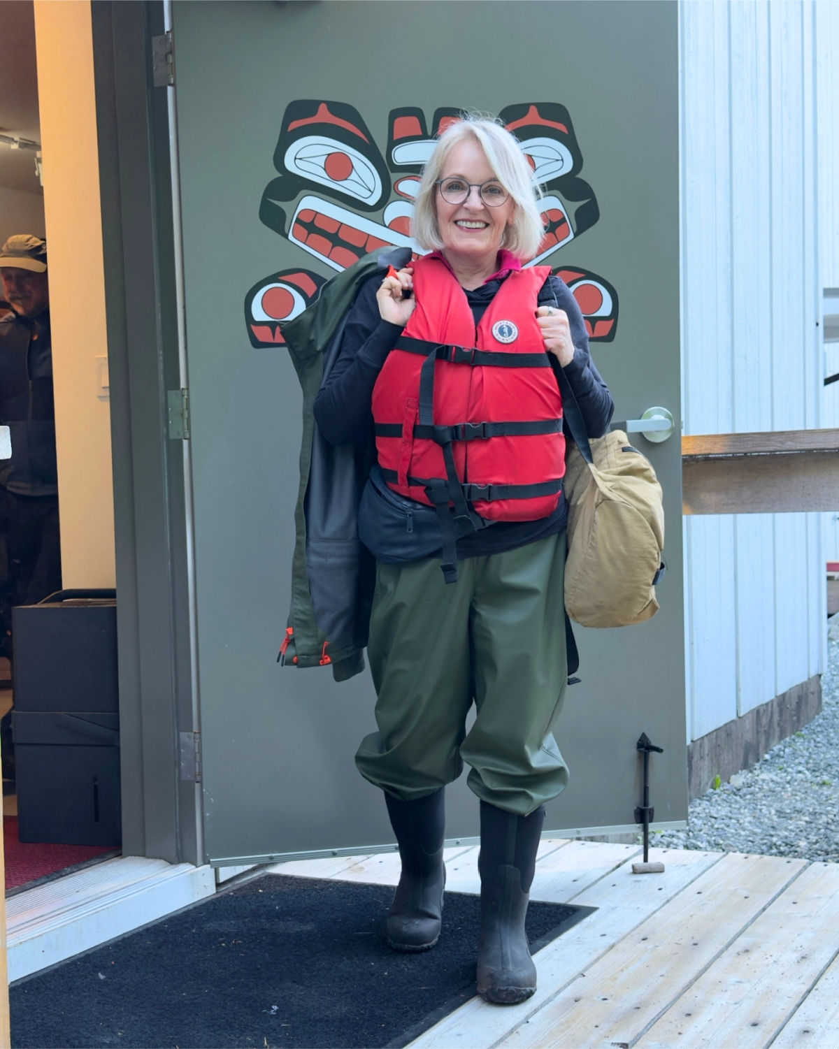 Wearing rubber pants and boots for a bear-watching excursion